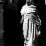 Old Clothing - Woman Wearing Dress Walking Beside Building