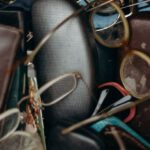 Swaps - Black and Brown Leather Bifold Wallet Beside Black Framed Eyeglasses