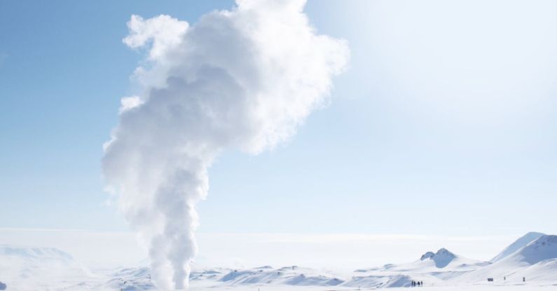 Geothermal Energy - Smoke Rising from Snow-covered Field